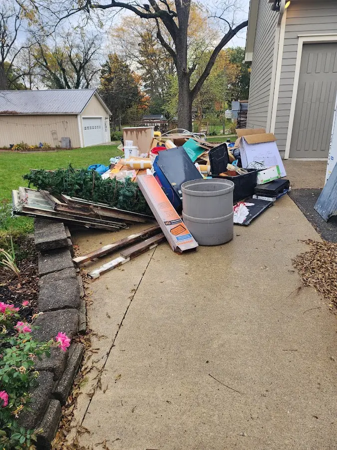 Dumpster being loaded with debris for Commercial Dumpster Rental in Yarmouth